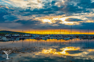 Sunset over the marina and harbor at Kirkwall.